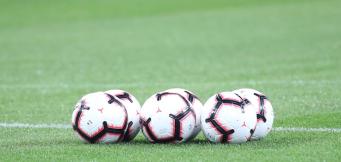 Footballs on Pitch