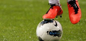 How can spending in football be controlled