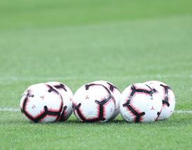 Footballs on Pitch